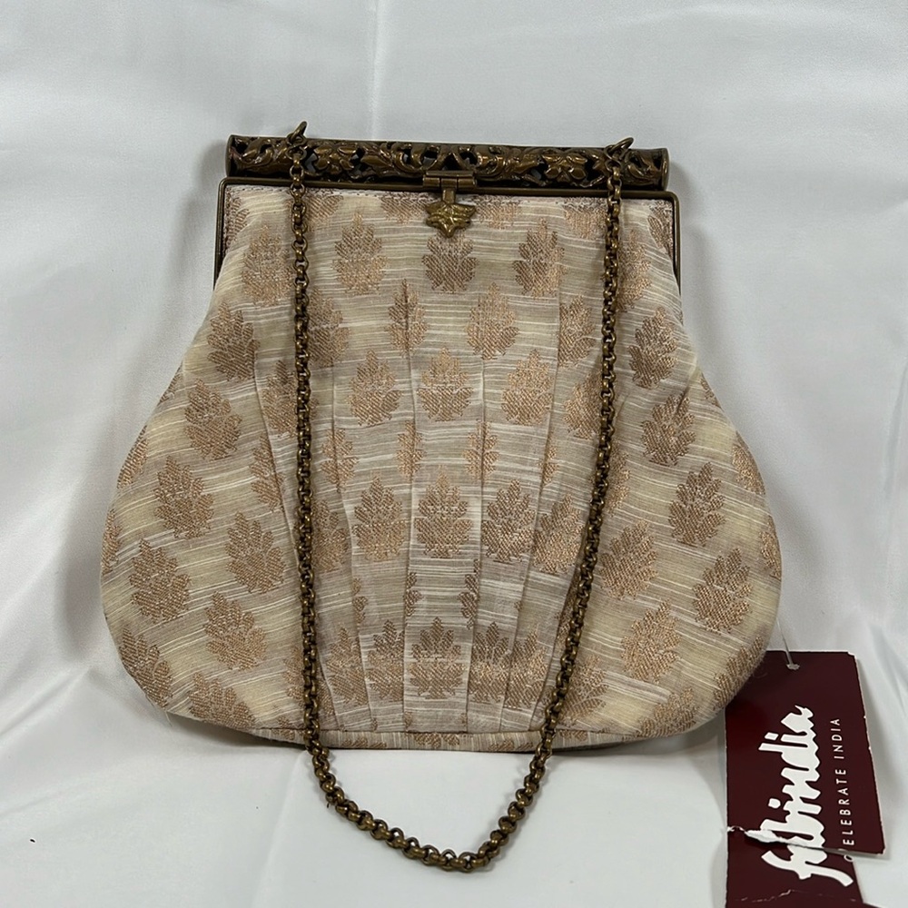 Silk Brocade clutch with ornate metal closure.